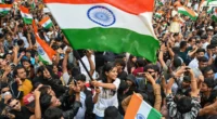 Young demonstrators gather near police barricades in New Delhi during protests over India's electoral roll revisions in October 2026.