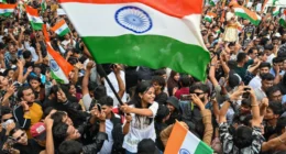 Young demonstrators gather near police barricades in New Delhi during protests over India's electoral roll revisions in October 2026.