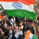 Young demonstrators gather near police barricades in New Delhi during protests over India's electoral roll revisions in October 2026.